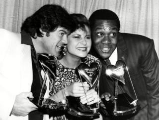 Comedians David Copperfield, Tracey Ullman and Lenny Henry with their awards for TV show 'Three of a Kind' at the Variety Club Awards in 1984
