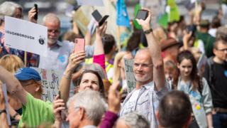 Protesters set off their mobile phone alarms at the same time to highlight the issue