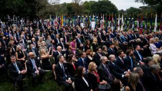 Attendees sitting together at a Rose Garden ceremony in September