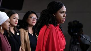 Ayannah-Pressley-speaks-while-ocasio-cortez-tlaib-omar-listen.