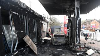 The car was parked beside the fuel pumps when it was set on fire
