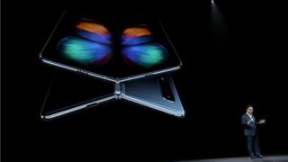 DJ Koh, President and CEO of IT & Mobile Communications Division of Samsung Electronics, announces the new Samsung Galaxy Fold smartphone during the Samsung Unpacked event on February 20, 2019 in San Francisco, California.