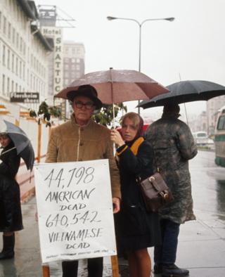 Demonstrators hold signs in Berkeley, California