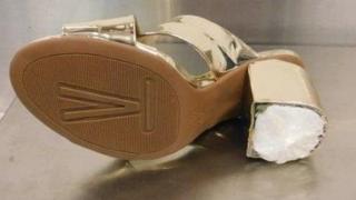 One of Woodrum's shoes on an airport scale