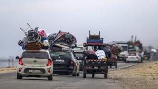 Furniture and other items strapped onto vehicles evacuating from Rafah, Gaza Strip