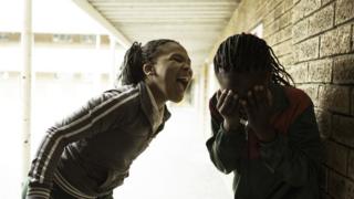 Two schoolgirls having a fight at playtime