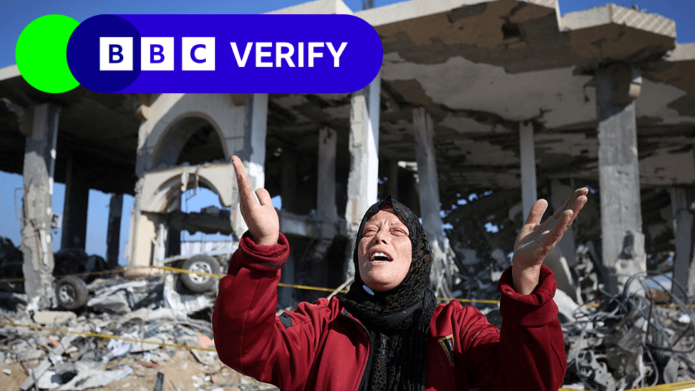 A Palestinian woman in front of a destroyed building in the Al-Maghazi refugee camp in the central Gaza Strip on January 16, 2024,
