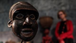 A Runner Mask, 'Mabu' from the Wum people, Cameroon, 1930s (estimate £5500 - 7,500) stands during a press preview at Summers Place Auctions on May 30, 2018 in Billingshurst, England