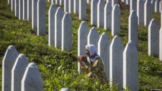 Woman prays at the Potocari cemetery and memorial near Srebrenica. File photo