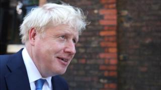 Boris Johnson is seen outside his office after being announced as Britain's next prime minister in London on 23 July 2019