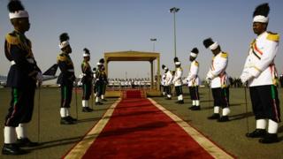 Members of the Sudanese honour guard stand to attention as they wait for the arrival of the Ethiopian prime minister in Khartoum on 2 May 2018