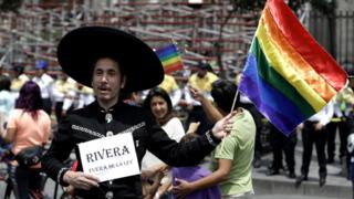 LGBT demonstration outside of Mexico City's Metropolitan Cathedral in Mexico City, Sunday, Sept. 11, 2016.