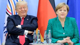 Дональд Трамп и Ангела Меркель на саммите в Гамбурге в июле 2017 года
