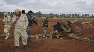 Syrian rebels prepare to fire artillery towards government positions west of Sheikh Miskeen (2 January 2016)