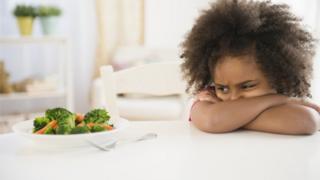 Boy not wanting to eat vegetables