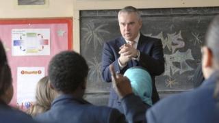 Huw Edwards at a school