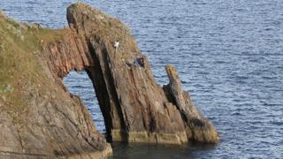 Teens on cliff