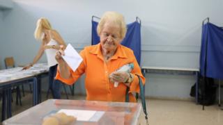 A woman votes in Greece, 7 July 2019