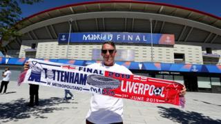 A man with a half-and-half scarf