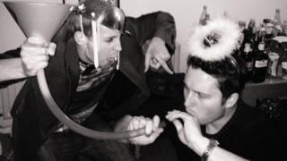 Giles taking part in the drinking game