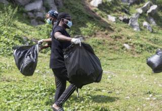 Volunteer cleaners at Mpape Crushed Rock near Abuja, Nigeria
