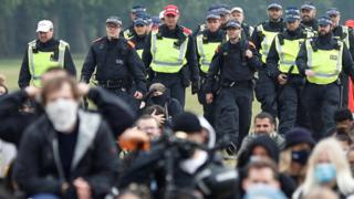 Police assembly beside Black Lives Matter protesters on Friday evening
