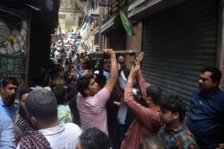 Fire Brigade and NDRF personnel carry out rescue works after the collapse of the four-storey Kesarbai building at Dongri on July 16, 2019 in Mumbai.