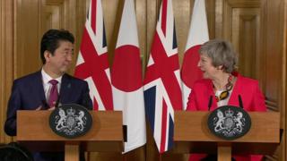 UK Prime Minister Theresa May and Japan's Prime Minister Shinzo Abe give a joint press conference