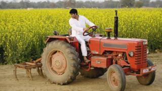 An Indian farmer on a tractor
