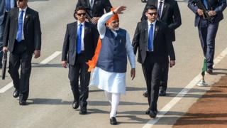 India's Prime Minister Narendra Modi (C) waves to the spectators as he attends the Republic Day parade in New Delhi on 26 January 2020.