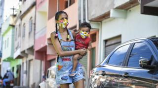 A woman and her child wearing colourful face-masks in Belo Horizonte, Brazil