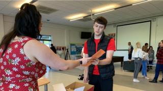 Student receives results at Birchwood Community High School Warrington