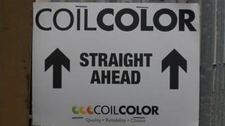 A sign for Coilcolor