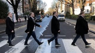 Four Mitchel Federans make their way across Abbey Road