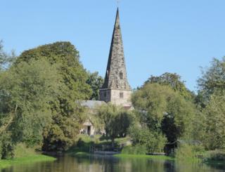 St. James. Church reflected over water