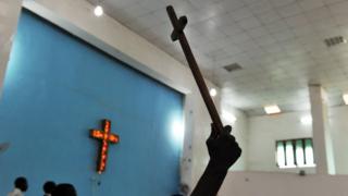 Person hold cross