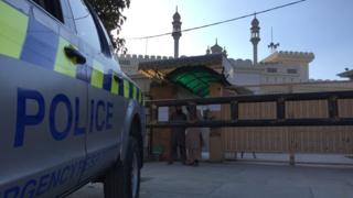 A police car parked in front of a former JuD-run mosque in Islamabad