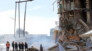 Rescue workers at the collapsed CTV building