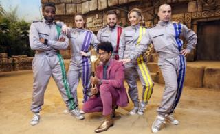 Richard Ayoade with Vicky Pattinson, Lydia Bright, Ore Oduba, Louis Spence and Alex Brooker