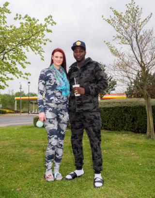 Challis Cooper (20) and Arnold (22) take a break at Baldock Extra Motorway Services, on their way to visit family in Great Yarmouth. Radwell, Baldock, Bedfordshire.