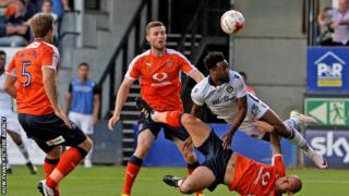 Marlon Jackson of Newport goes close with a diving header