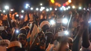 Protesters in Sudan with mobile phones at night - May 2019