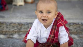 A baby wearing tartan in Gurro