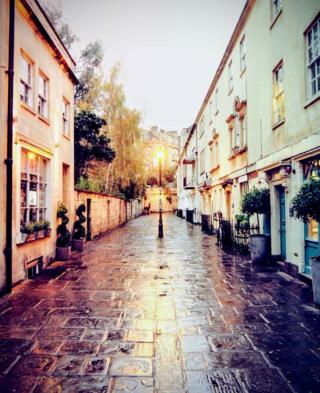 Street light reflected in stone path