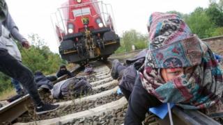Environmentalists block railway tracks and stop a train loaded with new Volkswagen cars that has left the Volkswagen plant in Wolfsburg, northern Germany, on August 13, 2019