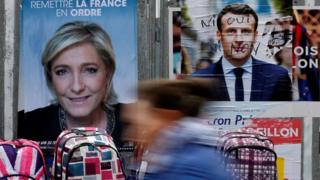 Campaign posters for Marine Le Pen and Emmanuel Macron