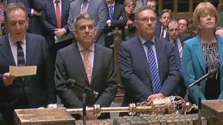 Tellers deliver the result of the vote in the Commons