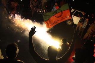 Supporters of Imran Khan, head of the Pakistan Tehreek-e-Insaf party, celebrate in Hyderabad.
