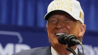 Former U.S. President and Republican presidential candidate Donald Trump reacts as he campaigns in Indianola, Iowa, U.S., January 14, 2024. REUTERS/Brendan McDermid