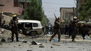 Afghan security personnel arrive at the site of a bomb blast that targeted Nato forces in Kabul on July 7, 2015